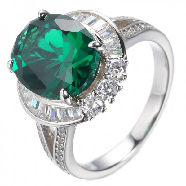 Oval Emerald Center And White Baguette Rhodium Plated Silver Ring 
