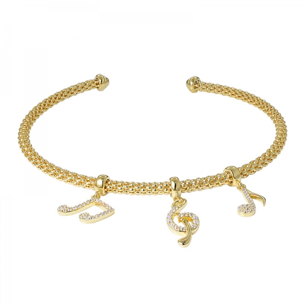 Music note rhinestones gold plating over charm bangle 