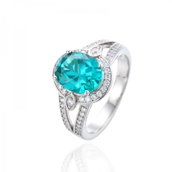 Oval Shape Paraiba And Round White Cubic Zirconia Rhodium Silver Ring 